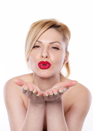 the beautiful blonde woman with lipstick isolated on the white backgroundの写真素材