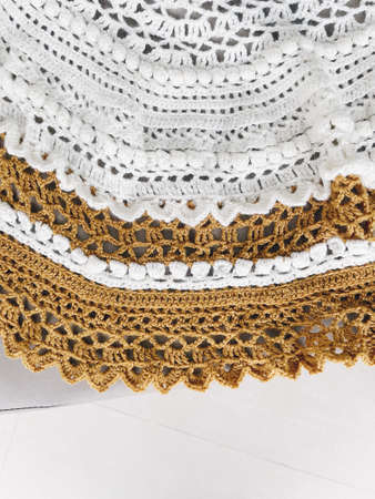 Crochet stole with white and yellow yarn.の写真素材