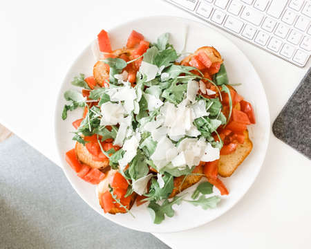 Italian bruschetta with parmesan at work.の写真素材