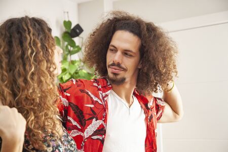Attractive african american man dancing salsa with his fiancee.