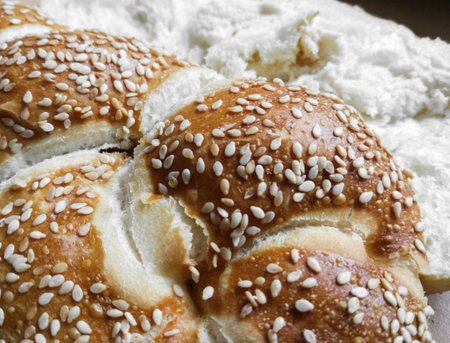 Detail of german milk brioche with sesame. Delicious breakfast choice.