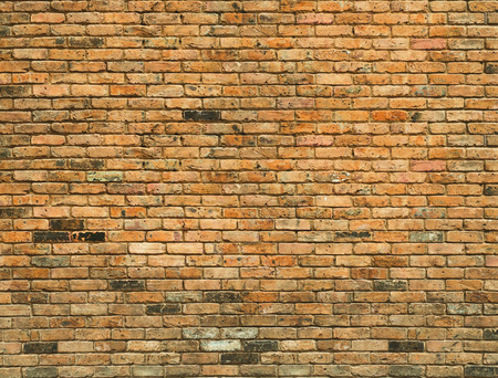 Detailed old yellow brick wall background photo textureの素材 [FY310115666991]