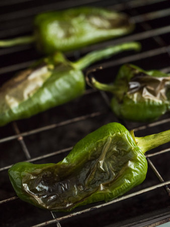 Padron peppers. Grilled green peppers. Spanish cuisine. Angle view. Roastedの写真素材