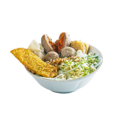 Beef hot meatballs bakso with vegetables, noodles, fried tofu and crispy fried Indonesian foodの写真素材