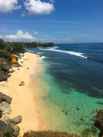 Sand beach in Bali with tropical sea and blue sky