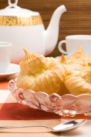 Cream puffs on a glass plate. Close up shoot.