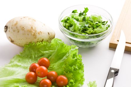 Fresh vegetables for salad over white backgroundの写真素材