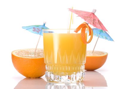 Cocktail of orange juice  and two halves of an orange on a white backgroundの写真素材