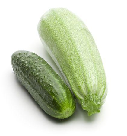 Raw ripe cucumber and squash on a white backgroundの写真素材