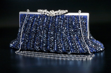 Blue evening bag over black backgroundの写真素材