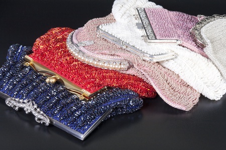 Stack of beaded evening bag over black backgroundの写真素材
