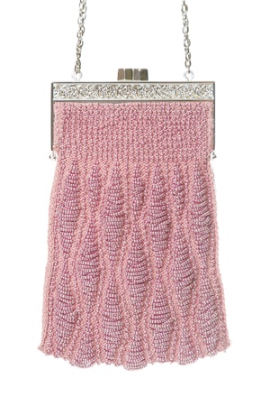Pink evening bag over white backgroundの写真素材