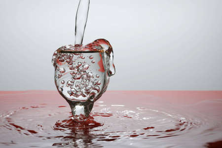 Movement of water is frozen by means of flashの写真素材