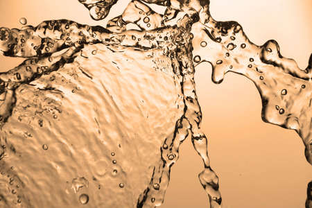 Movement of water is frozen by means of flashの写真素材