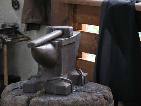 Anvil and hammer in an interior of a smithyの写真素材
