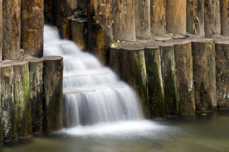 Small artificial  waterfalls photographed with long enduranceの写真素材