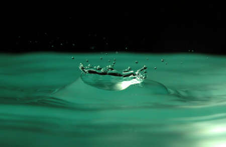 Movement of water is frozen by means of flashの写真素材