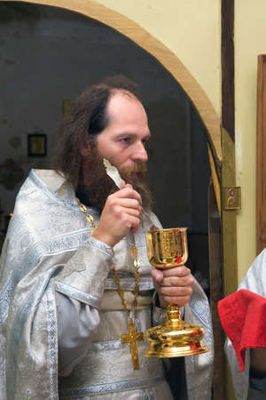 The Russian orthodox priest in a temple