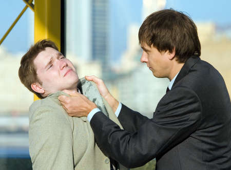 The conflict between two young business menの写真素材