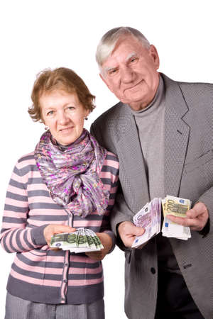 Elderly married couple with money in hands. Isolated on a White Backgroundの写真素材