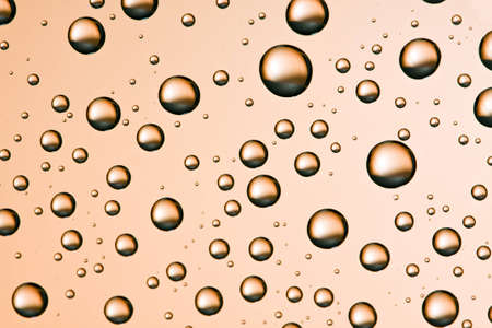 Water droplets on a transparent glass surfaceの写真素材