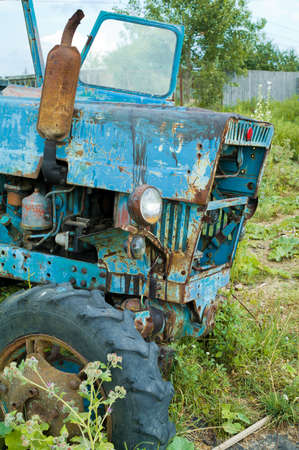 Old abandoned  tractor, rusty and brokenの写真素材