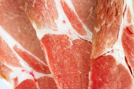 uncooked pork chops close upの写真素材