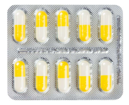 Pills in a blister pack on a white backgroundの写真素材