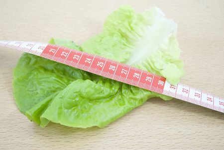 lettuce with tape measureの写真素材