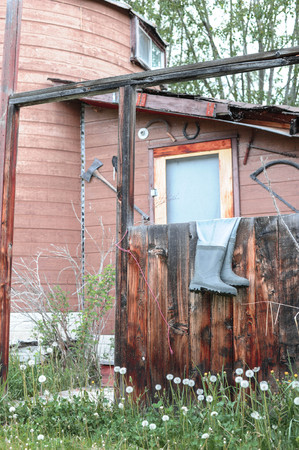 Old home stead with Gumboots on the fenceの写真素材