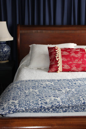 Bed with Red pillowの写真素材