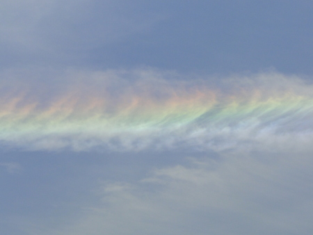 Beautiful iridescent or rainbow cloudの写真素材