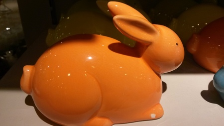 A vibrant-orange rabbit figurine can be gifted to friends as souvenir for display in their living room.の写真素材