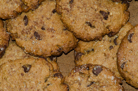 Chocolate chip cookies on a wooden board. Close-up.