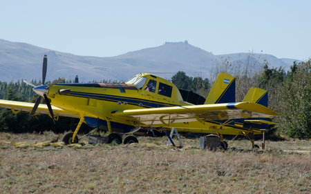 fire hydrant plane parked on a mountain aerodrome, yellow and blue firefighter planeの写真素材
