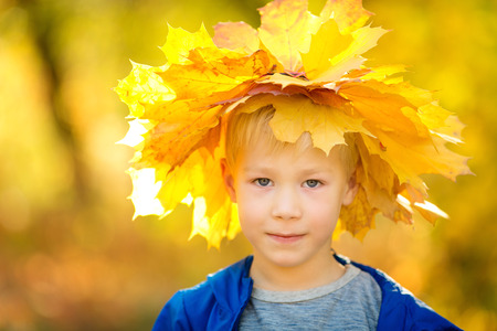Boy in the autumn parkの写真素材