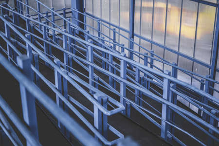 Overhead pedestrian crossing in the city. Light passes through plastic windows, metal is painted...