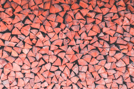 Surface of tightly laid wooden logs in the wallの写真素材