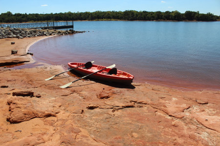 A kayak by the pier at Draper Lake in Oklahoma.の写真素材