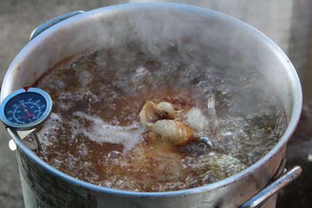 Deep fried turkey boiling close-up.の写真素材