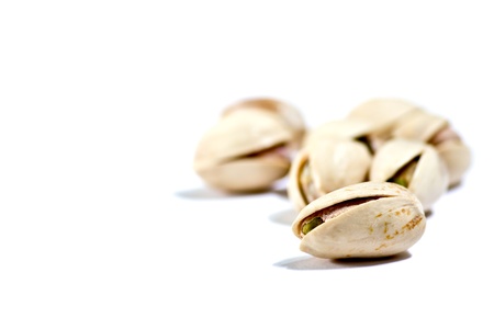 closeup image of pistachios on white backgroundの写真素材