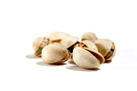 closeup image of pistachios on white backgroundの写真素材