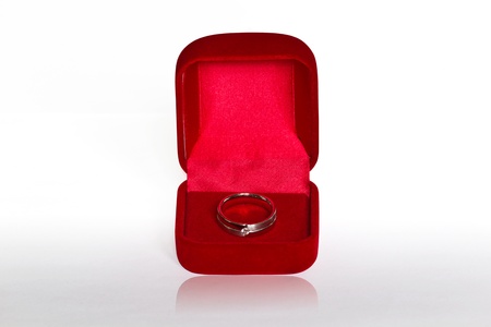 Ring in open red velvet box  isolated on white backgroundの写真素材