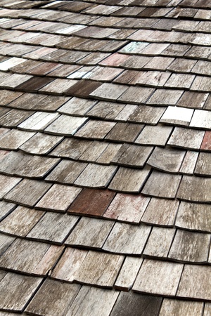 old worn shingle roof pattern in thailandの写真素材