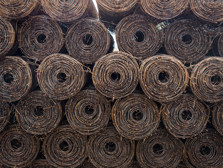 Stacked steel wire roll ready for construction.の写真素材