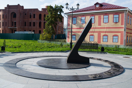 Sundial on the front. Cityscape.のeditorial素材