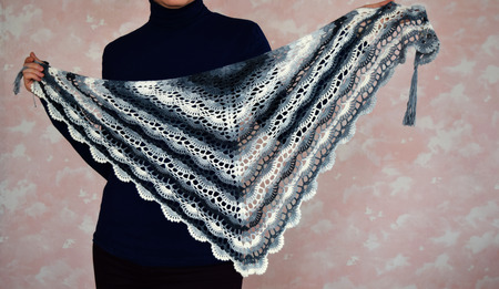 Woman in lace crochet. Woman with colorful shawl. Knitted shawl