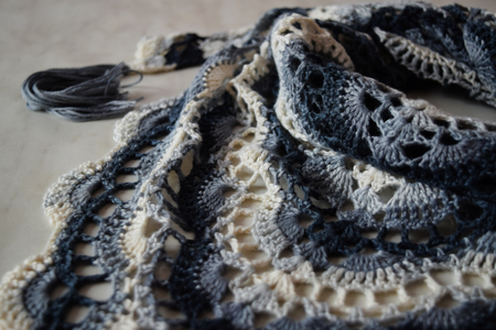 Knitted white-blue handkerchief for girl. Knitted shawl for for womanの写真素材