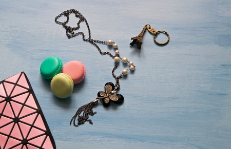 Cosmetic bag, decoration, key chain, macaroons on blue backgroundの写真素材