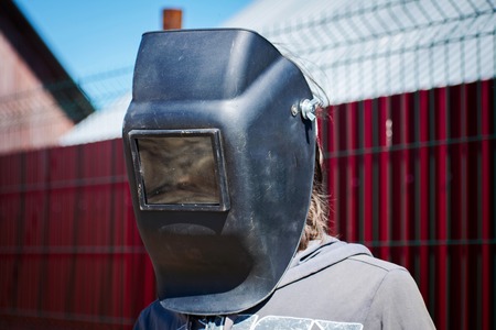 Welder or wizard in welding mask. Craftsman.